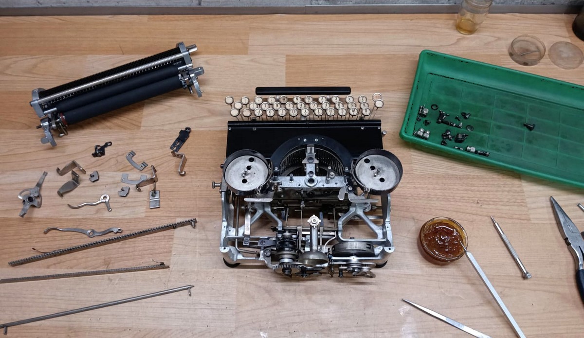 Varityper Folding typewriter disassembled during restoration